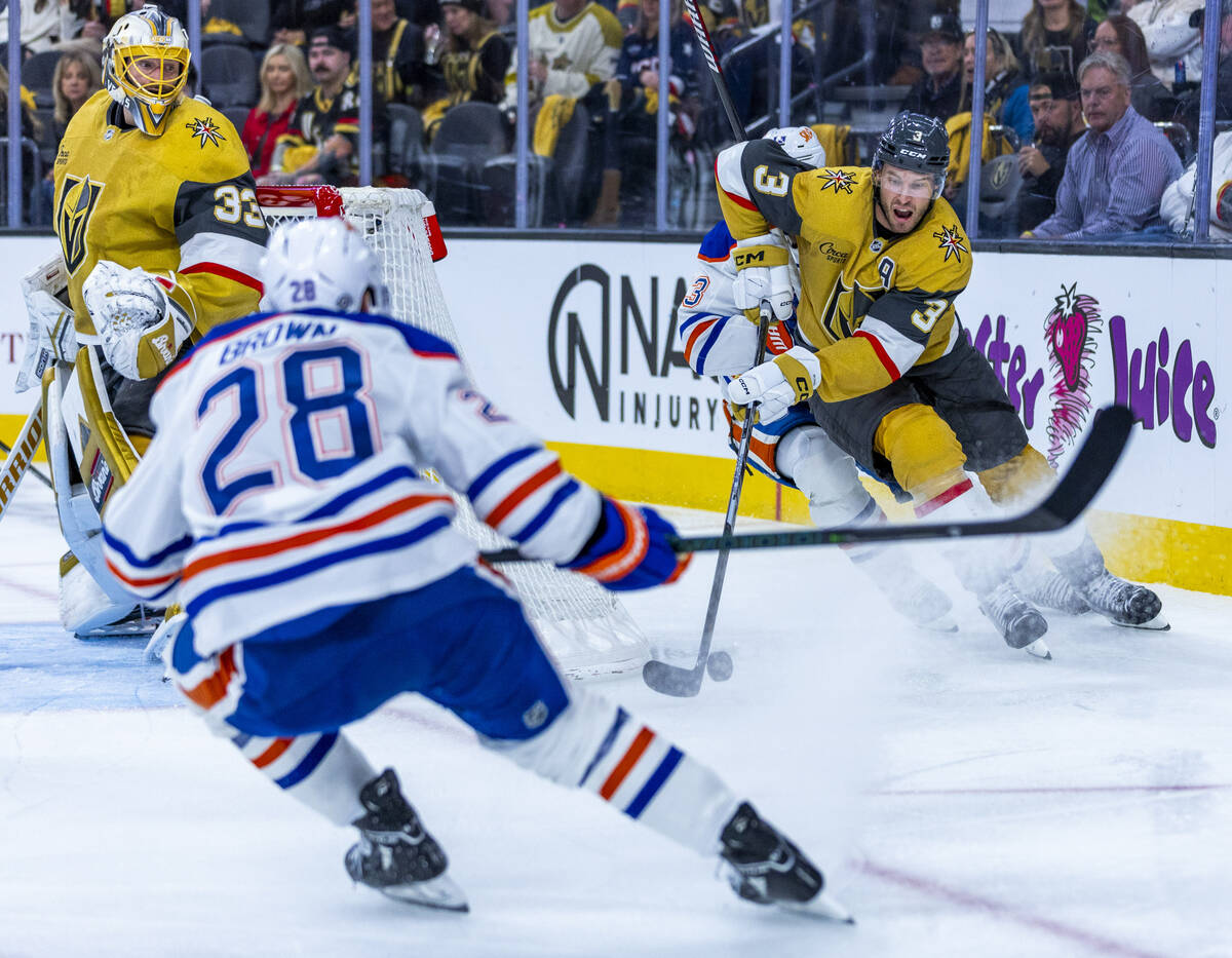 Golden Knights defenseman Brayden McNabb (3) takes the puck from Edmonton Oilers center Mattias ...