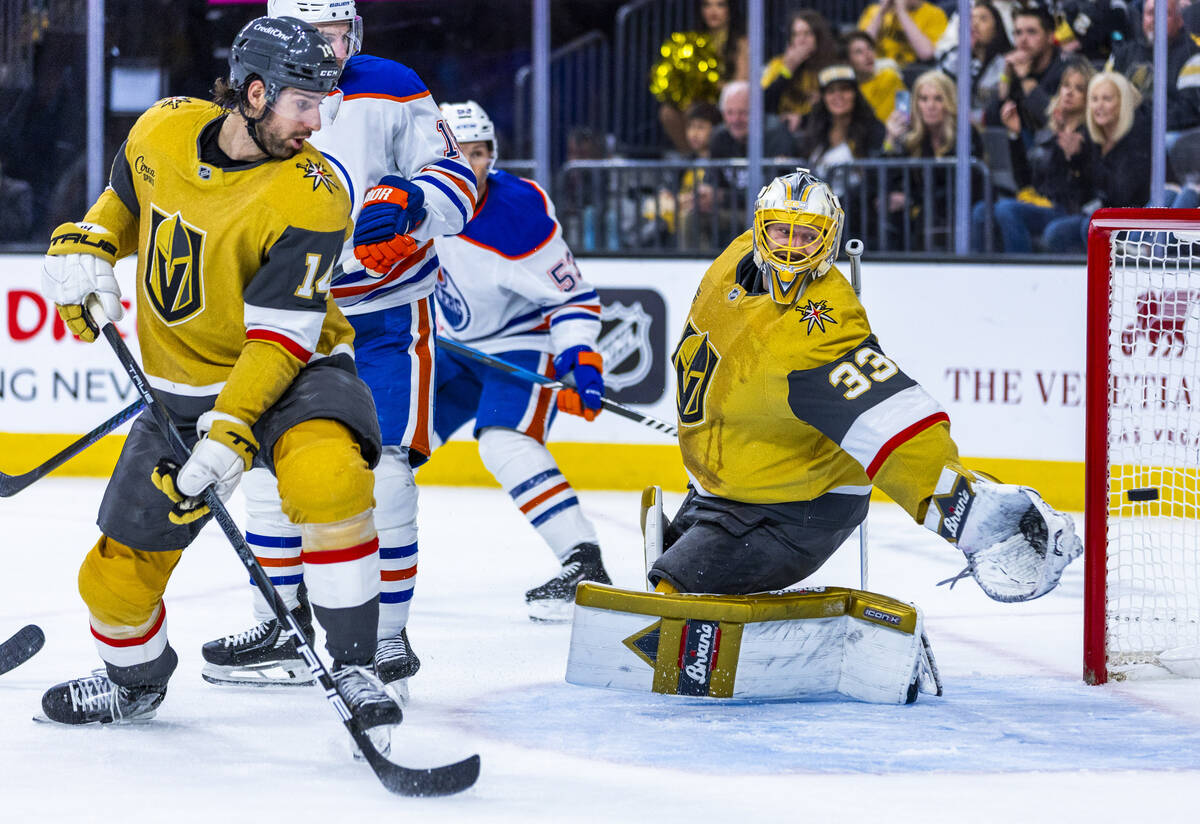 Golden Knights goaltender Adin Hill (33) watches as an Edmonton Oilers shot gets past during th ...