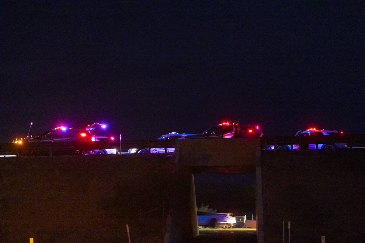 Nevada Highway Patrol officers investigate the scene of a fatal crash on northbound Interstate ...