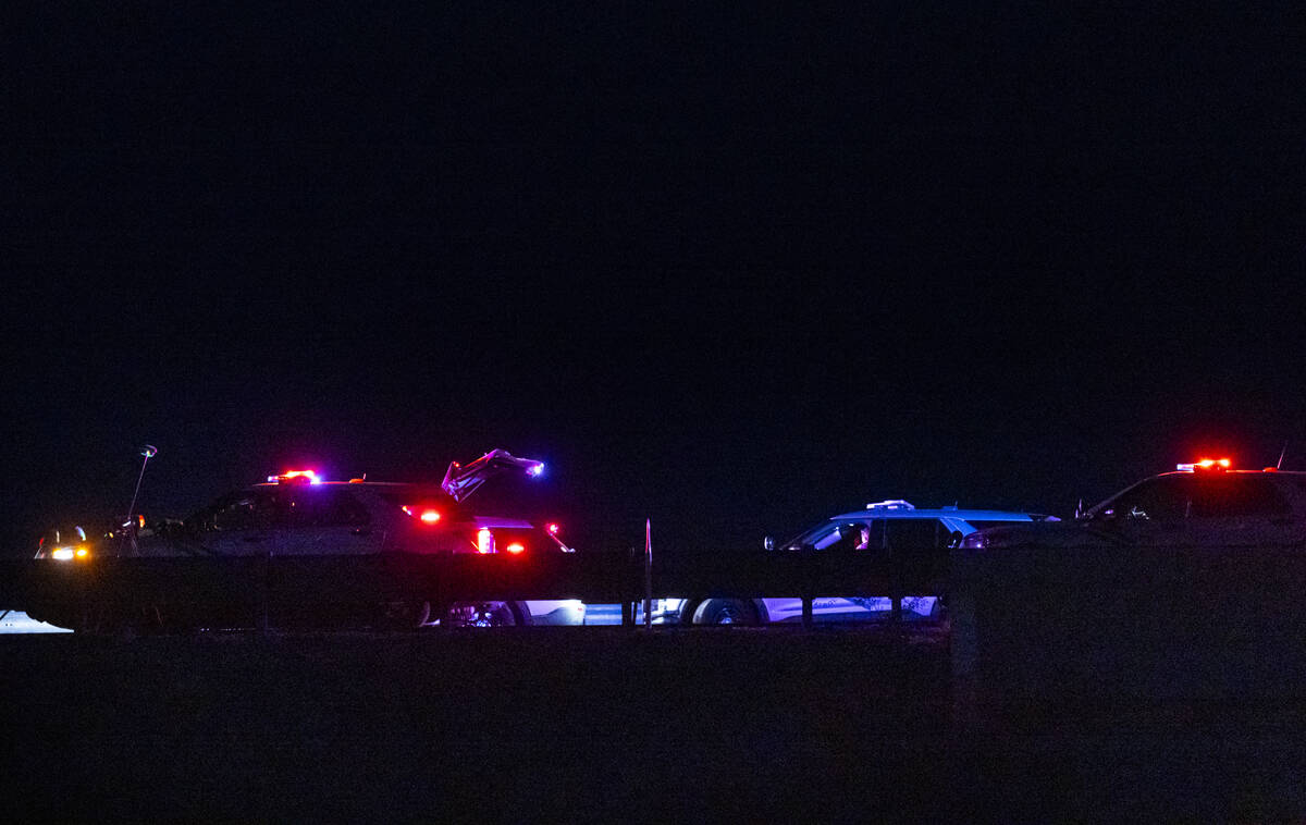 Nevada Highway Patrol officers investigate the scene of a fatal crash on northbound Interstate ...