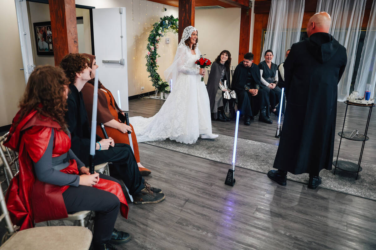 Celeste McCormack walks down the aisle during a “Star Wars” themed wedding at The ...
