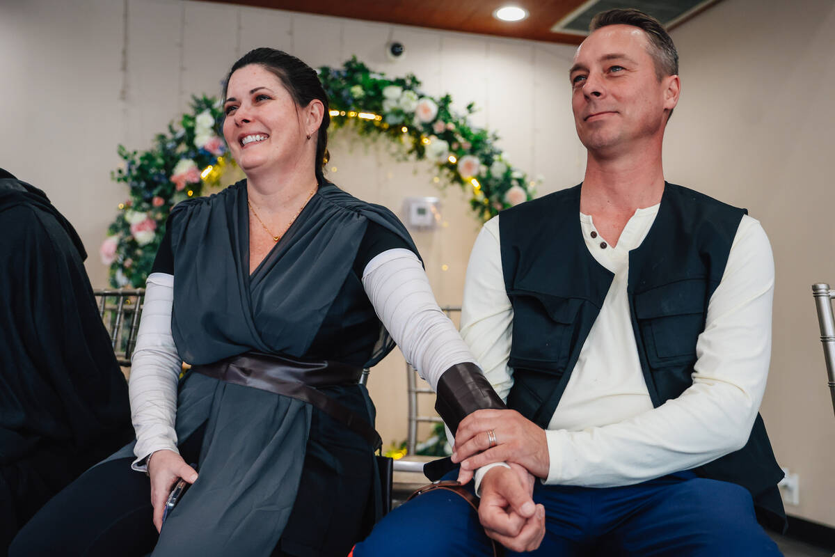 Wedding guests watch as Celeste and William McCormack (out of frame) get married during a &#x20 ...