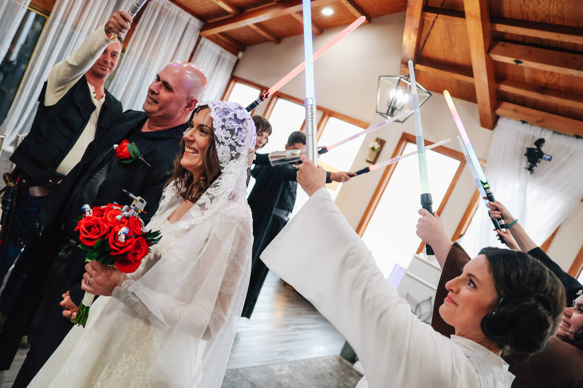 William McCormack, left, and his bride, Celeste McCormack, are introduced as a married couple d ...