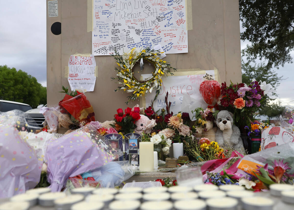 A makeshift memorial for McKenzie Scott, a senior at Arbor View High School, who was killed in ...