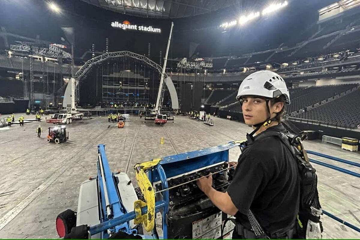 This is an undated photo of Servio "Sy" Perri using a lift during a stagehand job at ...