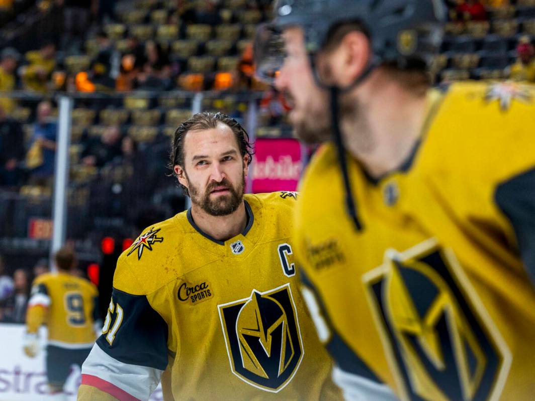 Golden Knights right wing Mark Stone (61) and teammates skate during the warm ups before first ...