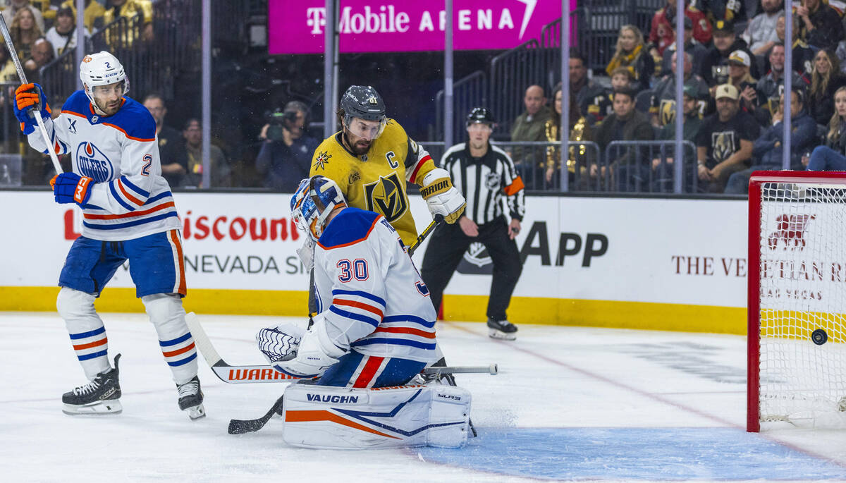Golden Knights right wing Mark Stone (61) shoots the puck past Edmonton Oilers goaltender Calvi ...