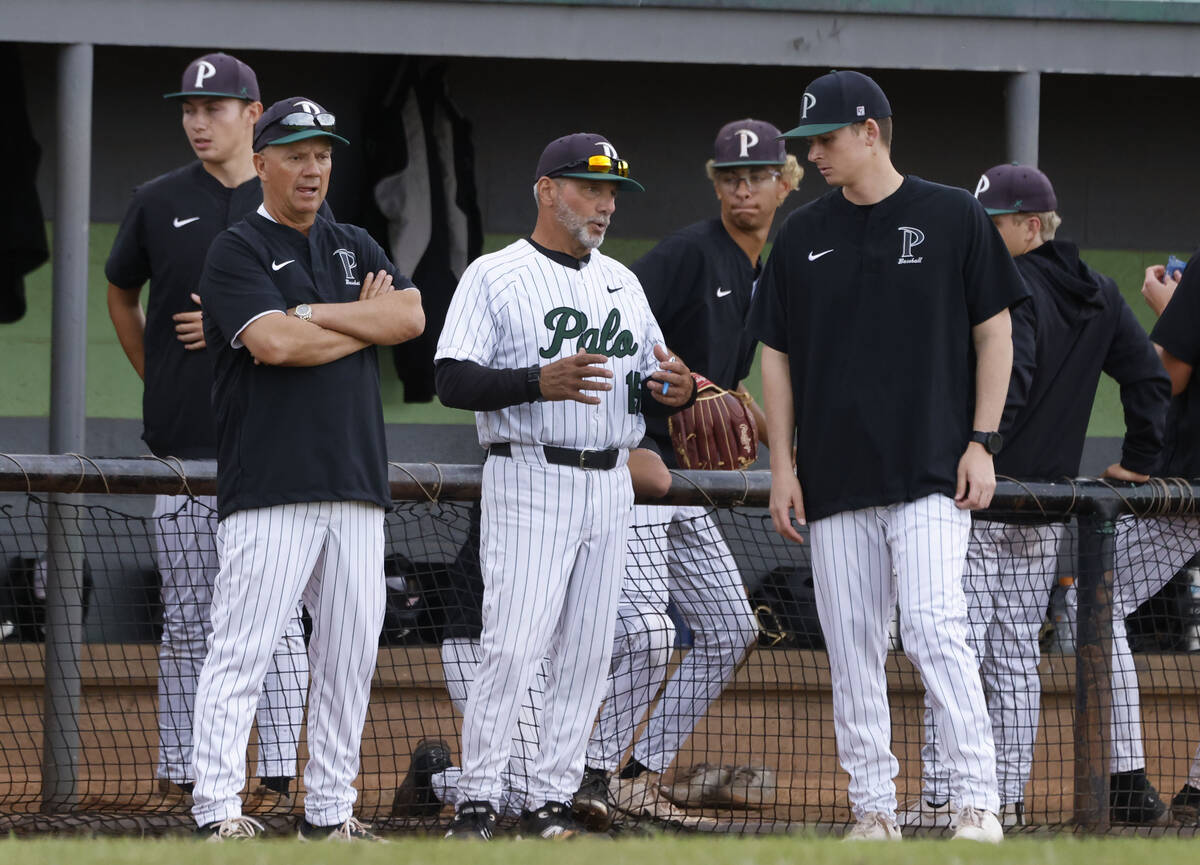 Palo Verde acting baseball coach Charlie Cerrone, center, discusses with coaches Greg Smith, le ...
