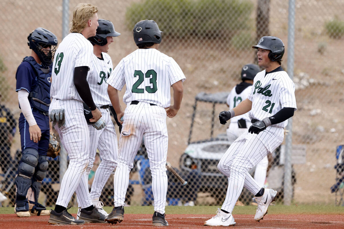 Palo Verde first baseman Tanner Johns receives a warm welcome as he touches the home plate afte ...