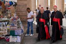 Cardinal José Tolentino de Mendonça, left, walks with Cardinal Gianfranco Ravasi at t ...