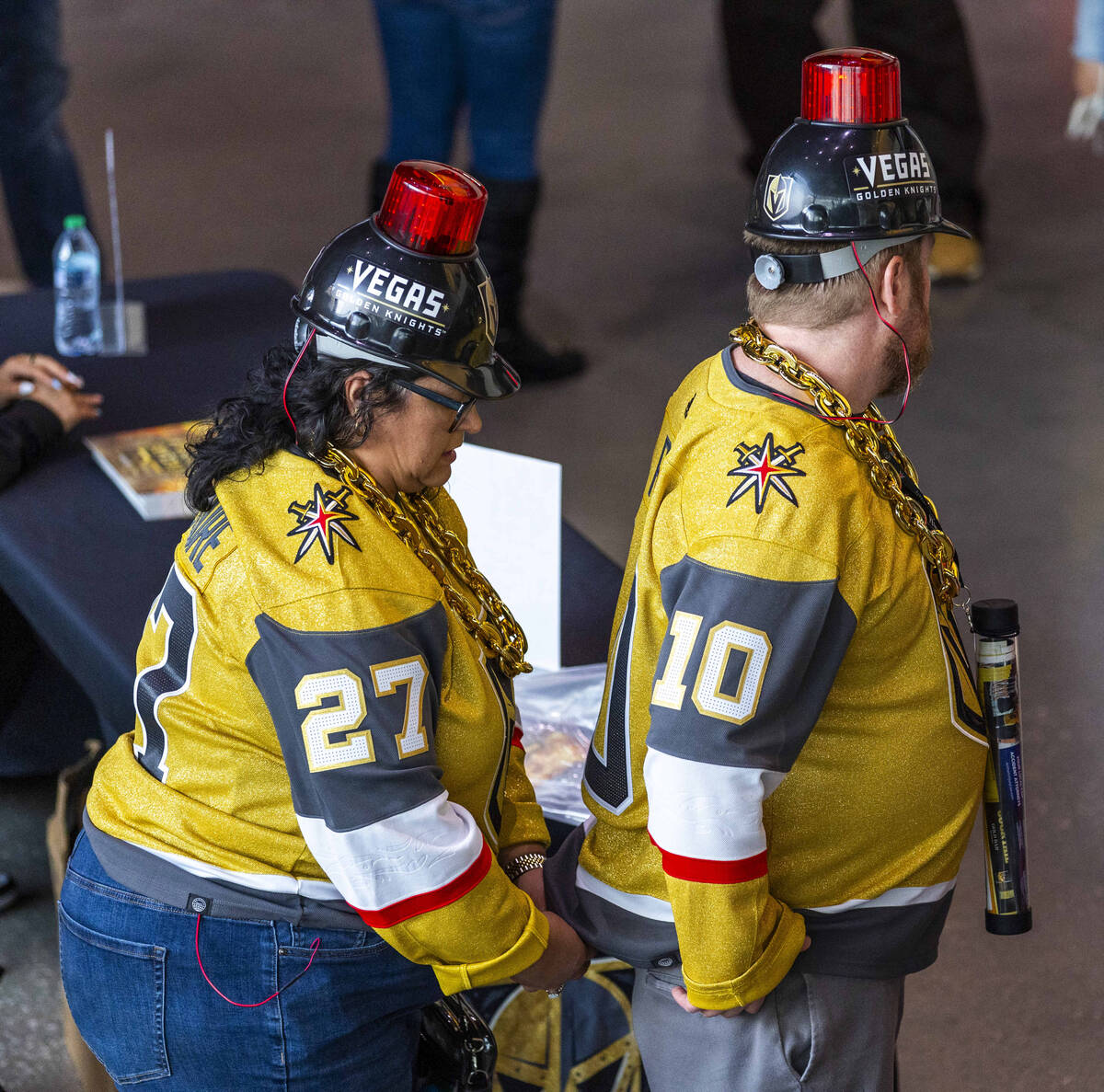 Fans with electric hats get wired up before first period of game one in the Golden Knights and ...