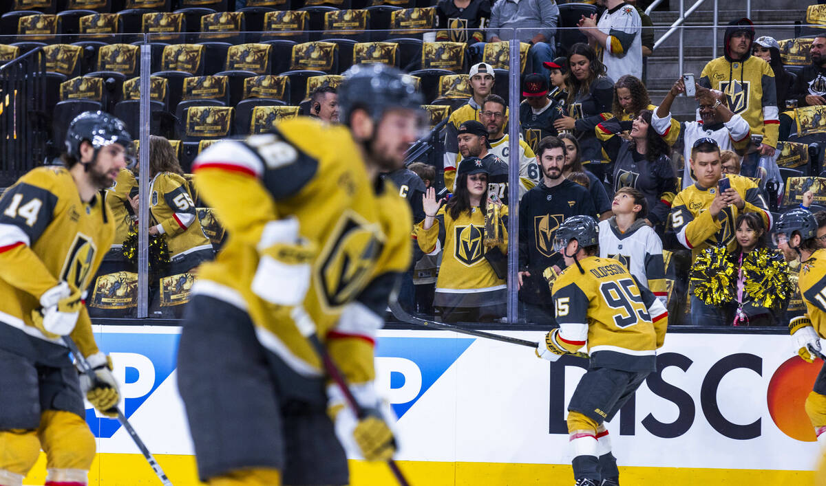 Fans watch as players take the ice during the warm ups before first period of game one in the G ...