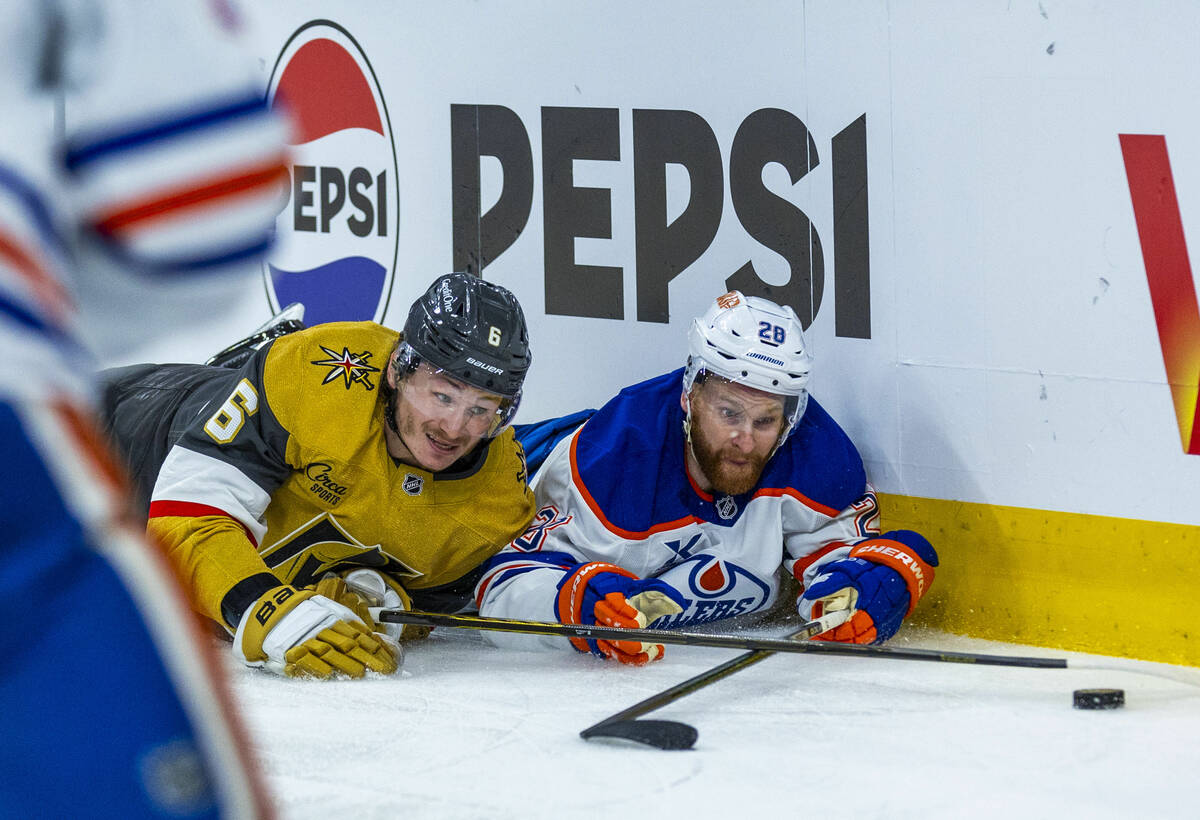 Golden Knights defenseman Kaedan Korczak (6) and Edmonton Oilers right wing Connor Brown (28) g ...