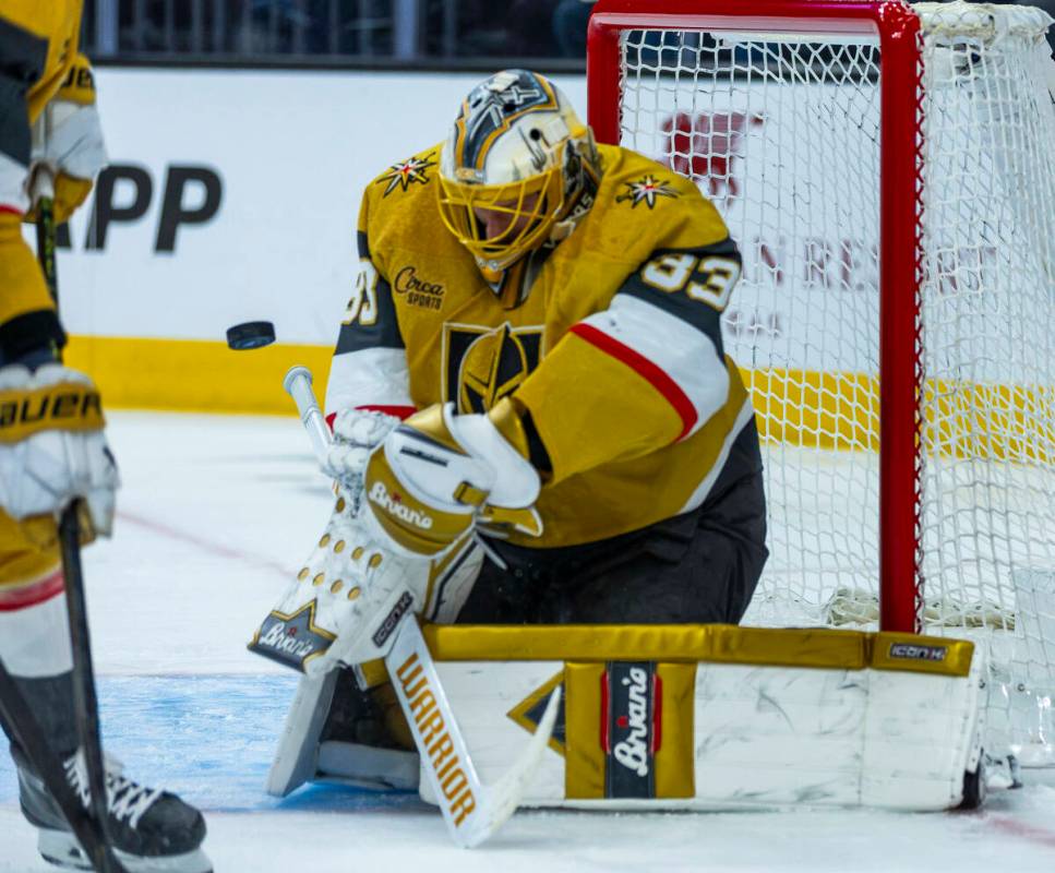 Golden Knights goaltender Adin Hill (33) deflects an Edmonton Oilers shot during the second per ...