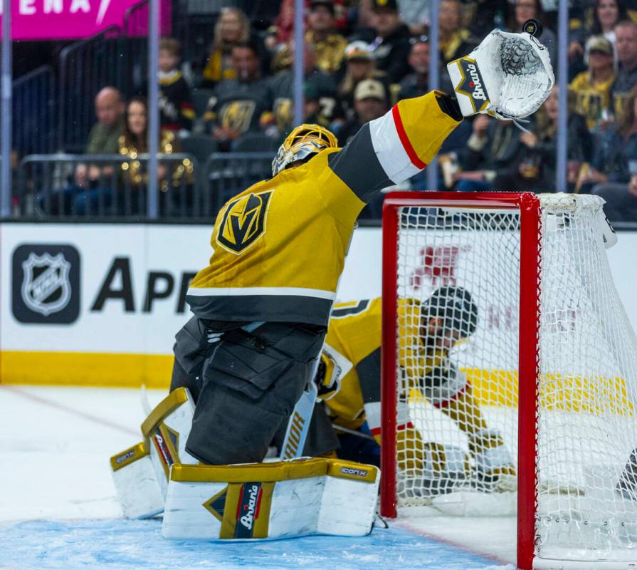Golden Knights goaltender Adin Hill (33) extends to grab a high shot from the Edmonton Oilers d ...
