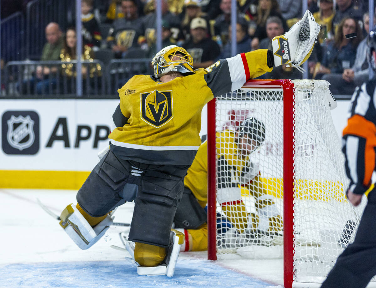 Golden Knights goaltender Adin Hill (33) extends to grab a high shot from the Edmonton Oilers d ...