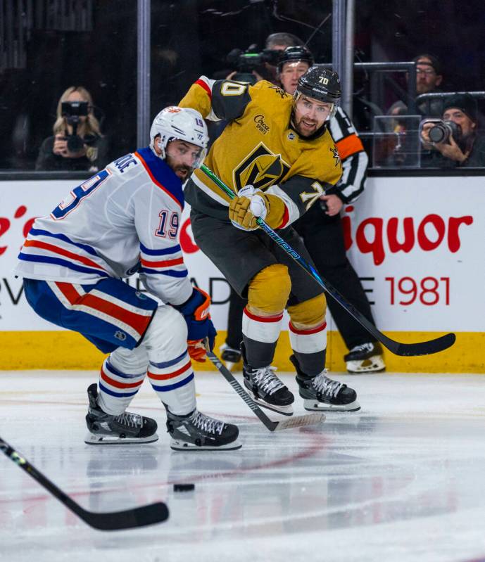 Golden Knights left wing Tanner Pearson (70) sends a pass across past Edmonton Oilers center Ad ...