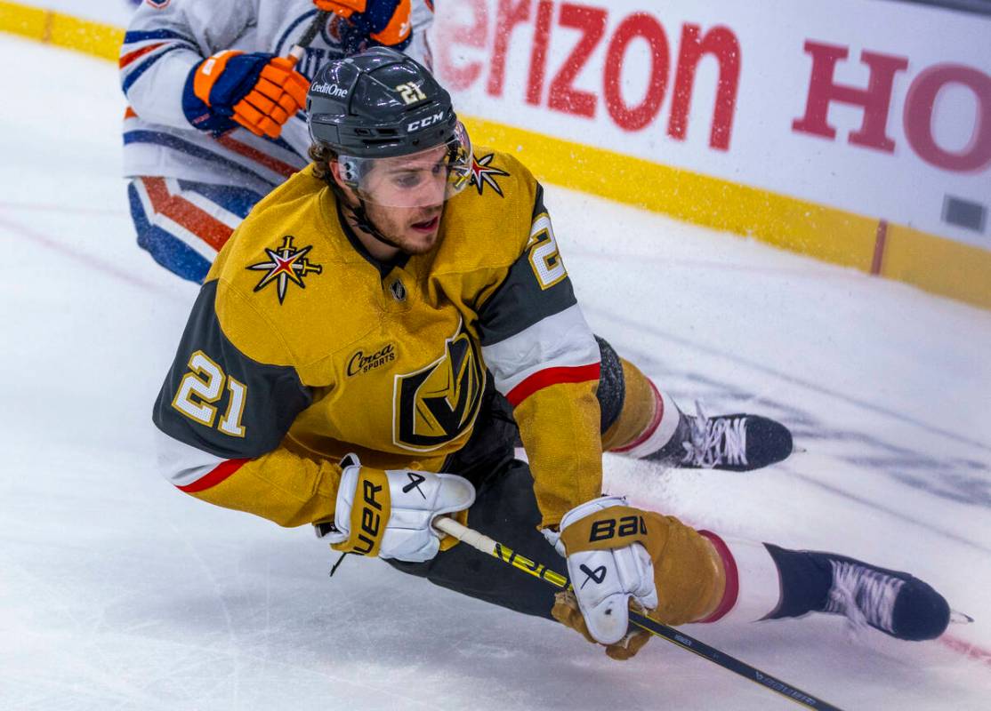 Golden Knights center Brett Howden (21) goes to the ice chasing a puck against the Edmonton Oil ...