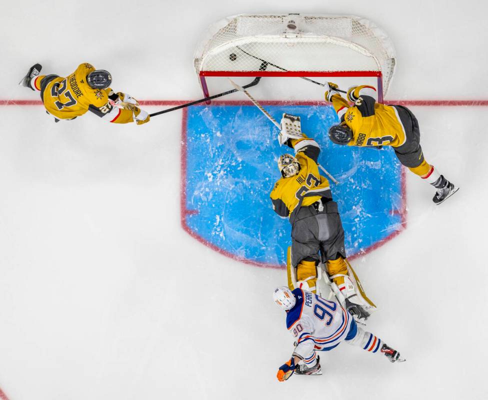 Golden Knights goaltender Adin Hill (33) is scored on by Edmonton Oilers right wing Corey Perry ...