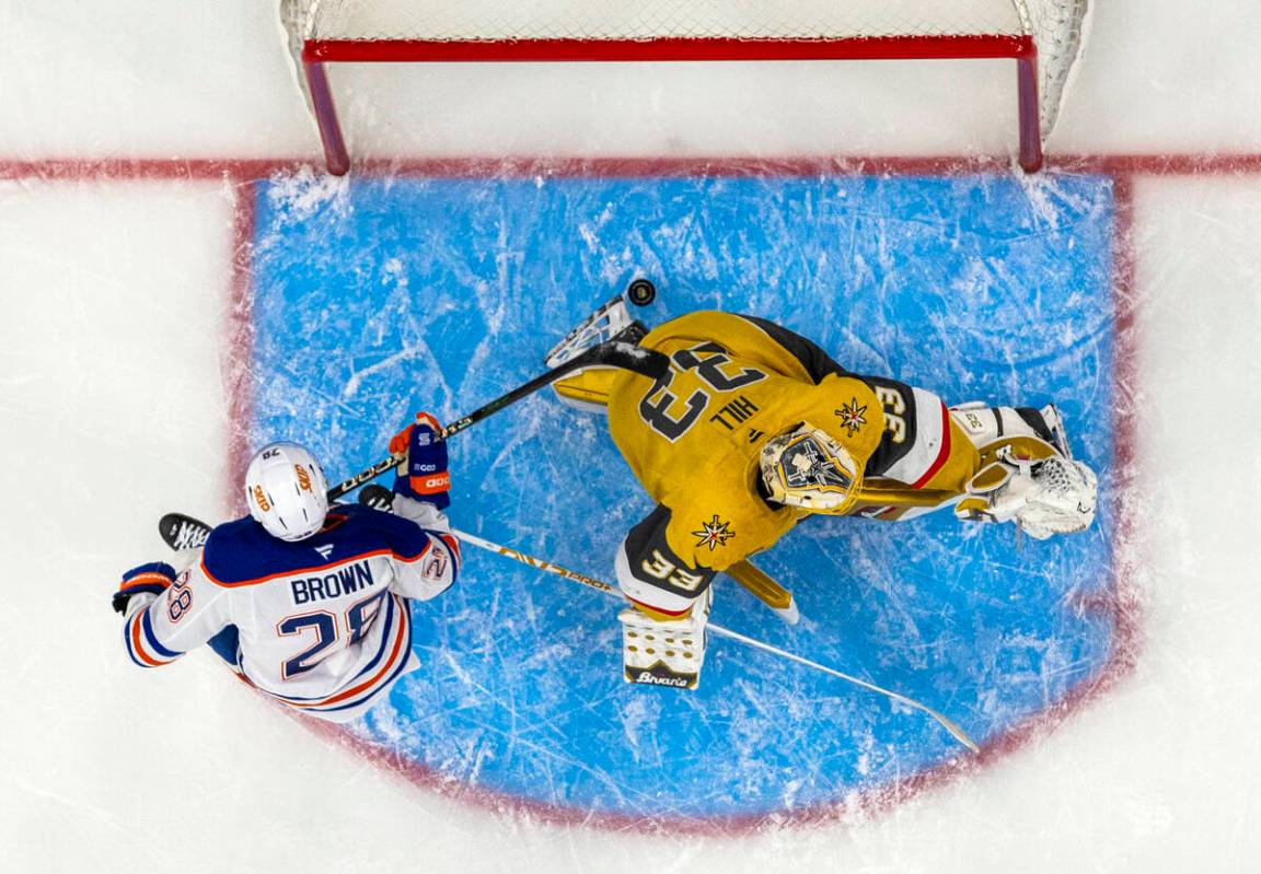 Golden Knights goaltender Adin Hill (33) is unable to stop a goal by Edmonton Oilers right wing ...