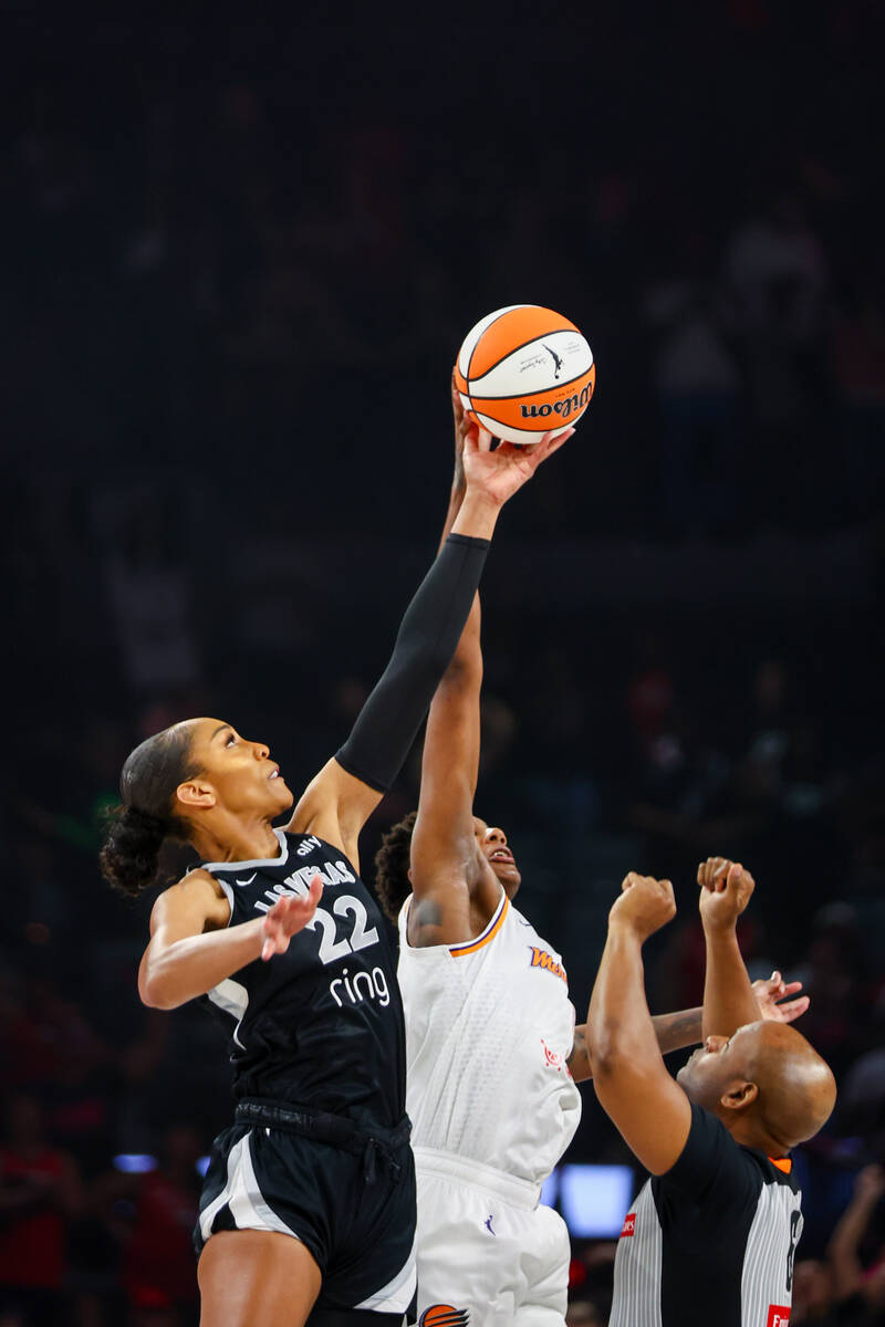 Aces center A’ja Wilson (22) fights for the tipoff against Mercury (4) at the start of a ...