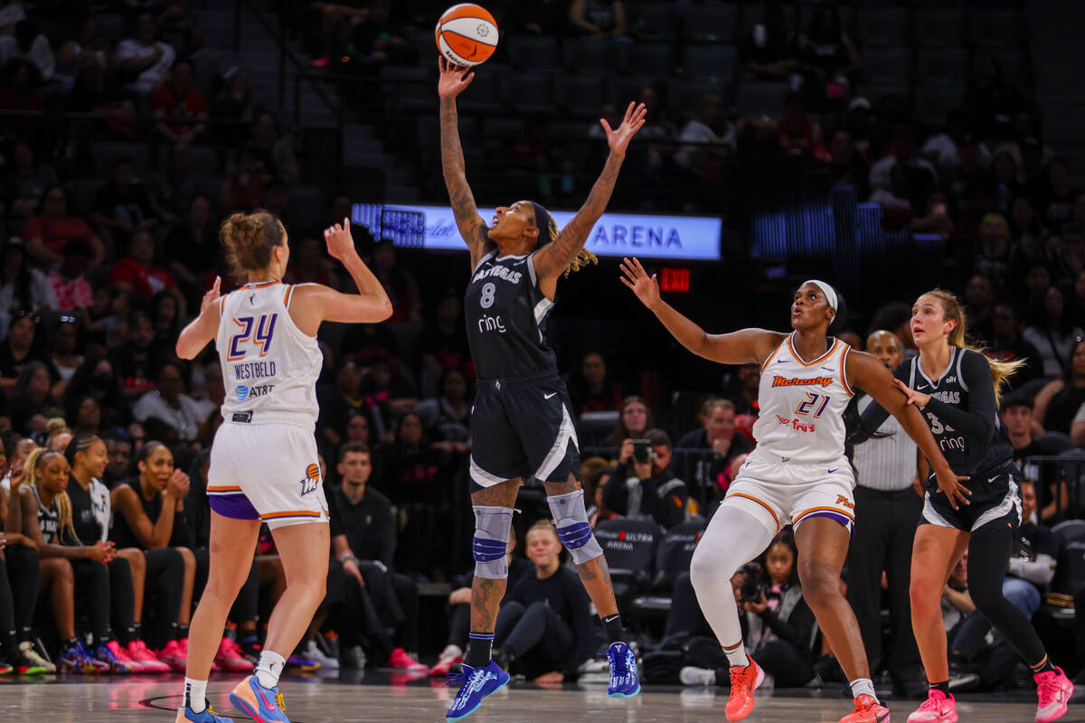 Aces forward Crystal Bradford (8) deflects an attempted three-pointer by Phoenix Mercury forwar ...