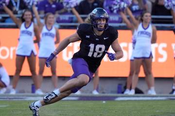 TCU wide receiver Jack Bech (18) runs during the first half of an NCAA college football game ag ...