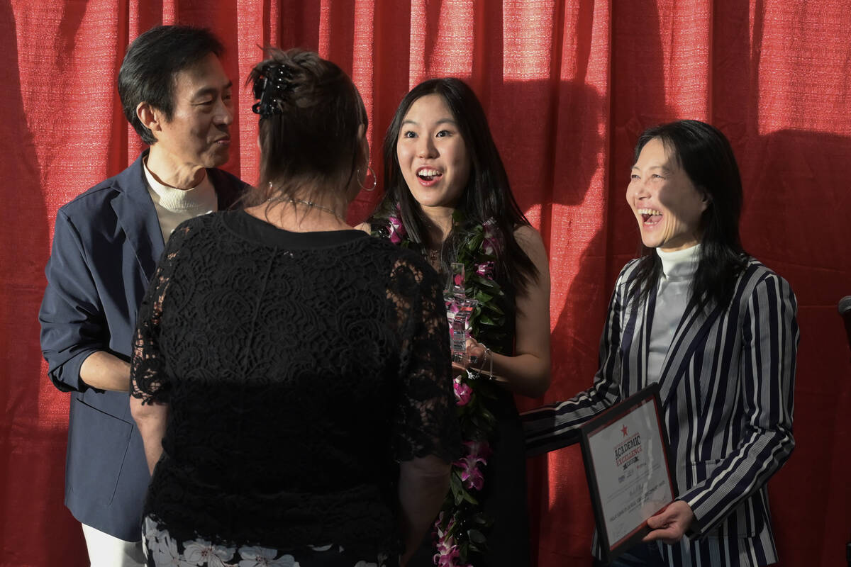 Findlay Subaru of Las Vegas Love Promise Community Award winner Michelle Park, flanked by her p ...
