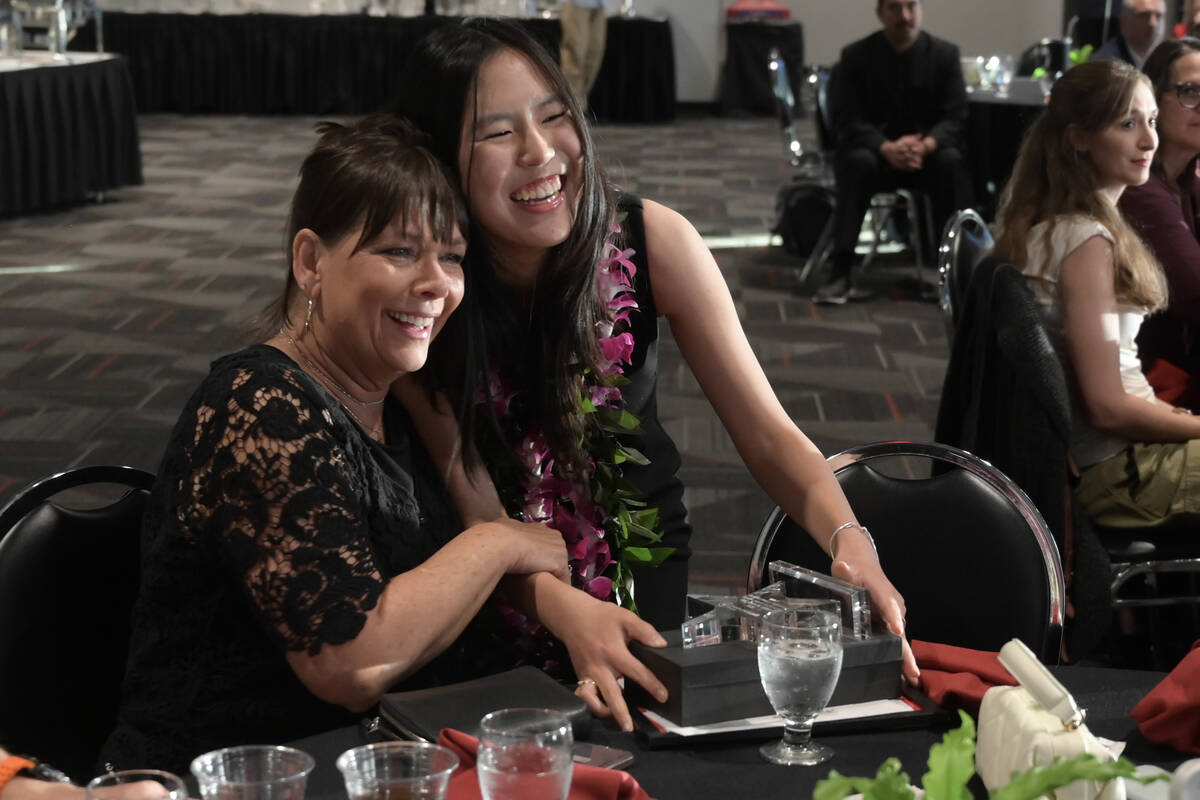 Michelle Park gets a hug from her student advisor Rebecca Chura after receiving the Findlay Sub ...