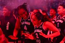 Aces forward-center Queen Egbo (4) celebrates with teammate Deja Kelly (2) after Kelly scored t ...