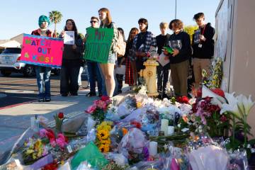 Students hold a protest near a makeshift memorial for McKenzie Scott, a senior at Arbor View Hi ...