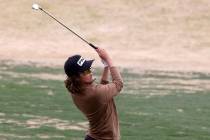 Sky Pointe's Drake Harvey watches his approach shot on the first hole during the NIAA Class 4A ...