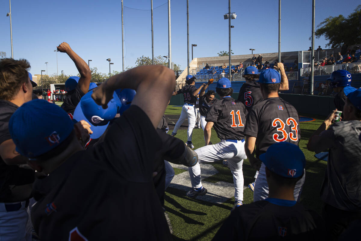 Bishop Gorman's Jonas Yatson, in the background, celebrates his home run against Arbor View dur ...