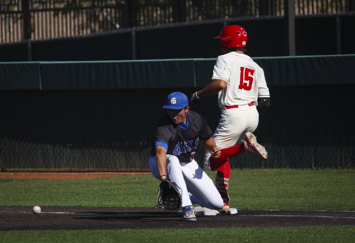Arbor View's Colton Christman (15) gets to first base against Bishop Gorman's Chase Wilk (28) d ...