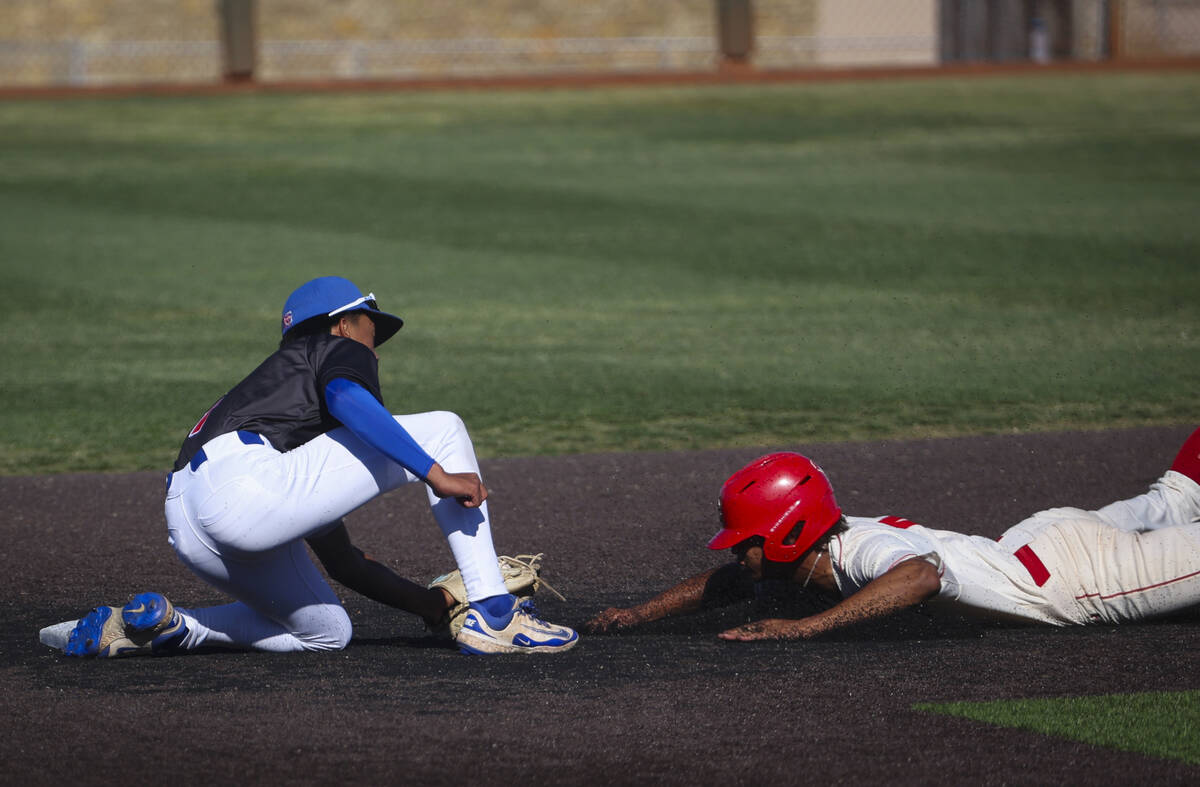 Arbor View's Devin Martin, right, gets tagged out by Bishop Gorman's Justin Rodrigues at second ...