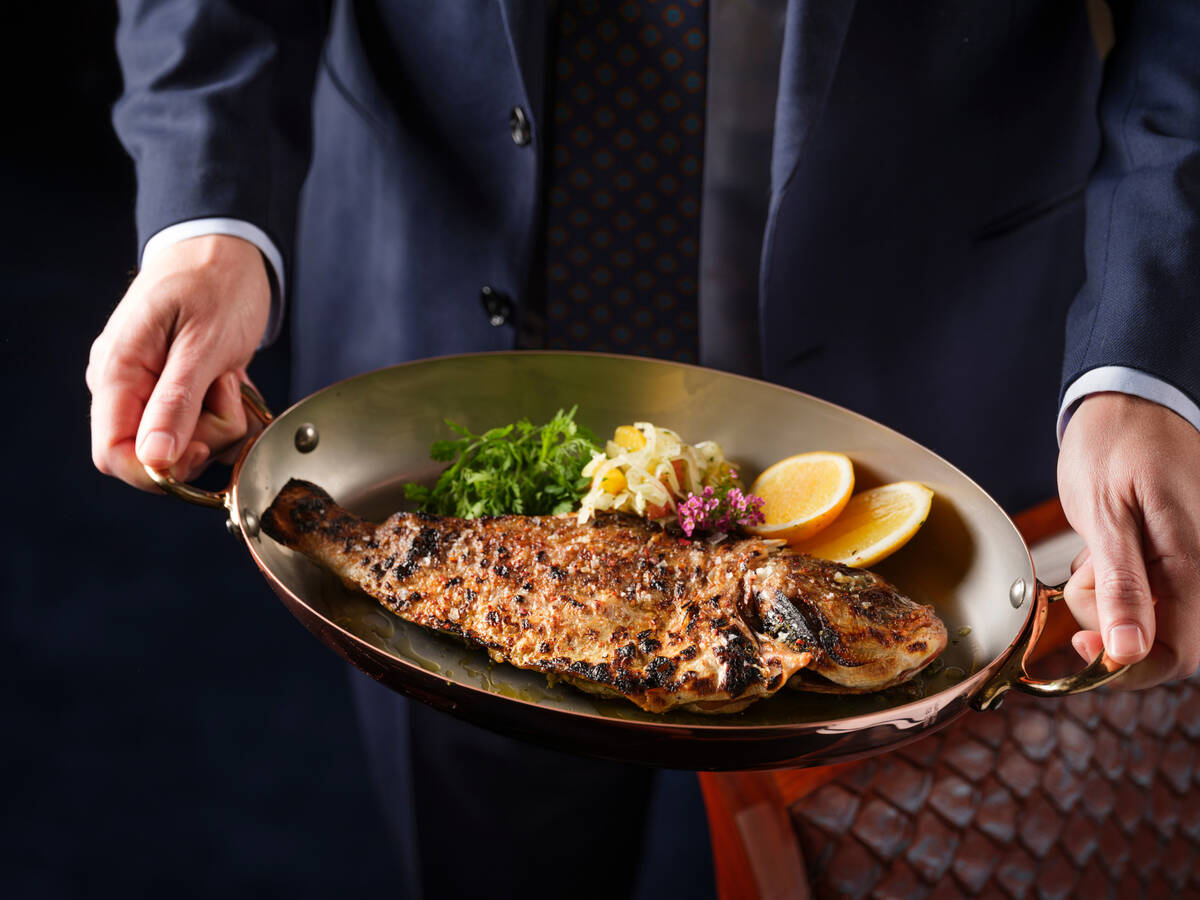 Whole grilled orata, a Mediterranean sea bream, from Pisces Bar & Seafare, a new seafood restau ...