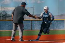 Centennial’s Sloane Merrell (8) high fives her coach as she rounds third base after hitt ...