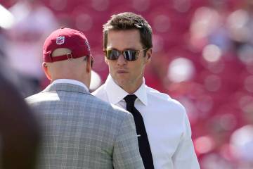 Former quarterback Tom Brady, right, is shown before an NFL football game between the San Franc ...