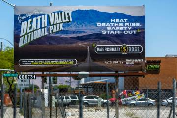 One of 300 billboards going up across the country targeting cuts to staff and services at natio ...