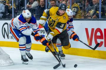 Golden Knights defenseman Brayden McNabb (3) catches some air as he keeps the puck from Edmonto ...
