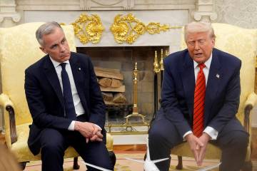 Prime Minister Mark Carney and U.S. President Donald Trump engage in a meeting at the White Hou ...