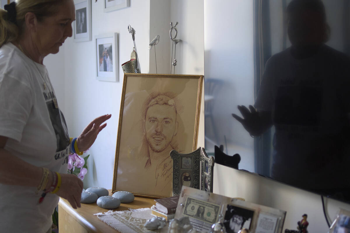 Ruhama Bohbot, mother of hostage Elkana Bohbot, has a picture of her son on display at her home ...
