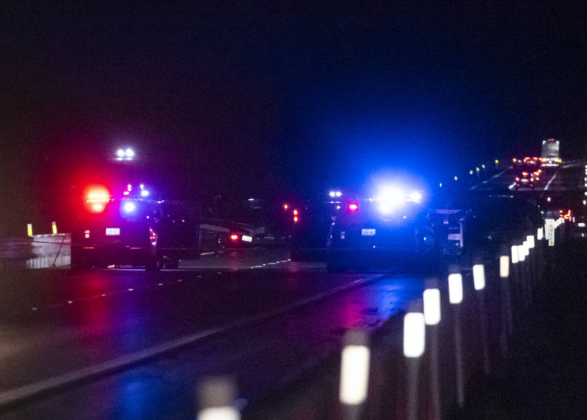 Nevada Highway Patrol officers investigate the scene of a fatal crash on northbound Interstate ...