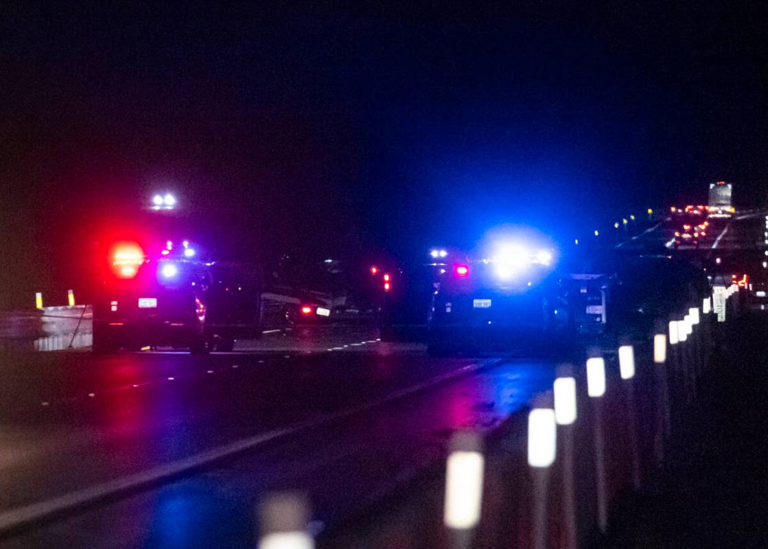 Nevada Highway Patrol officers investigate the scene of a fatal crash on northbound Interstate ...