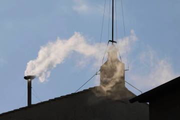 White smoke billows from the chimney of the Sistine Chapel where 133 cardinals are gathering on ...