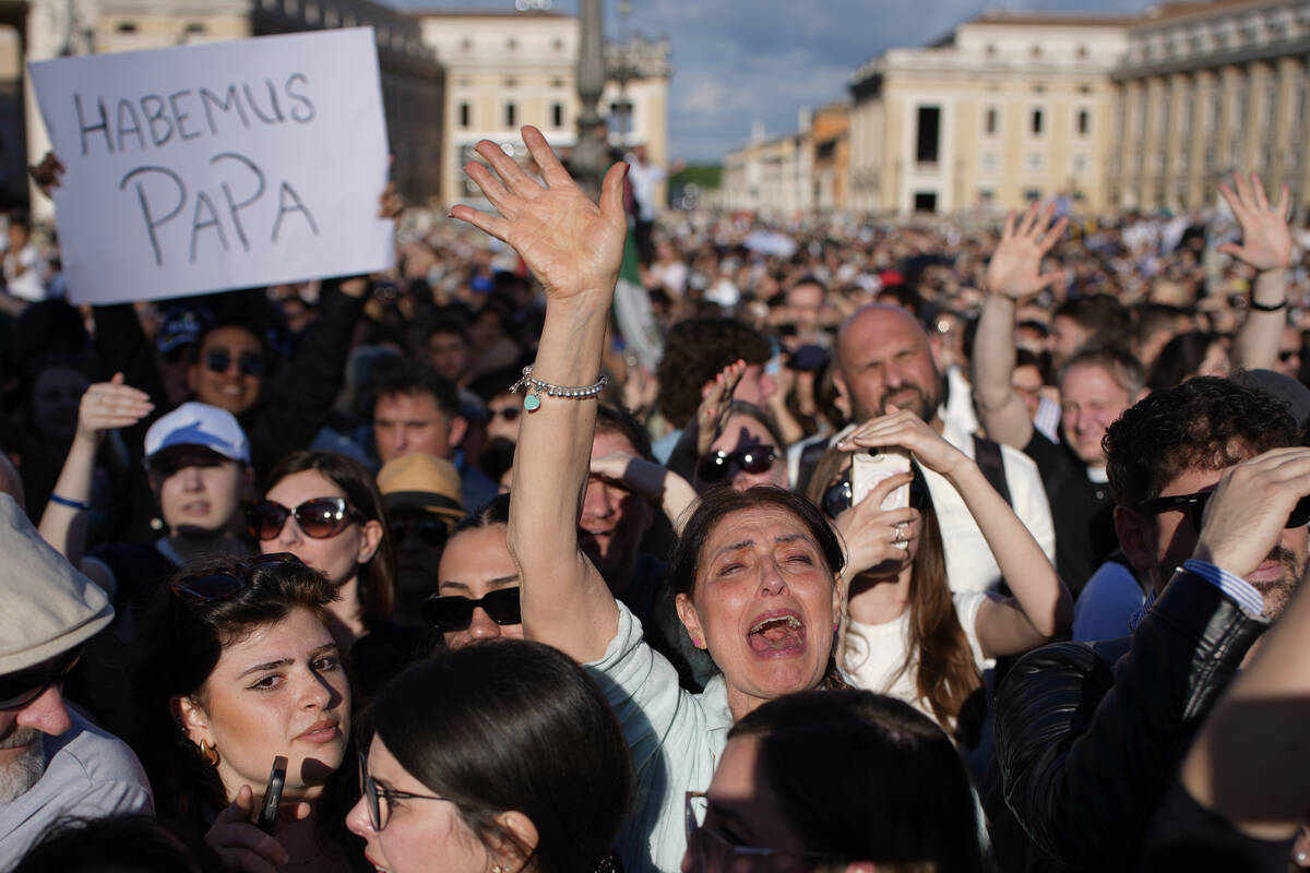 Faithful celebrate after white smoke appeared from the chimney of the Sistine Chapel where 133 ...