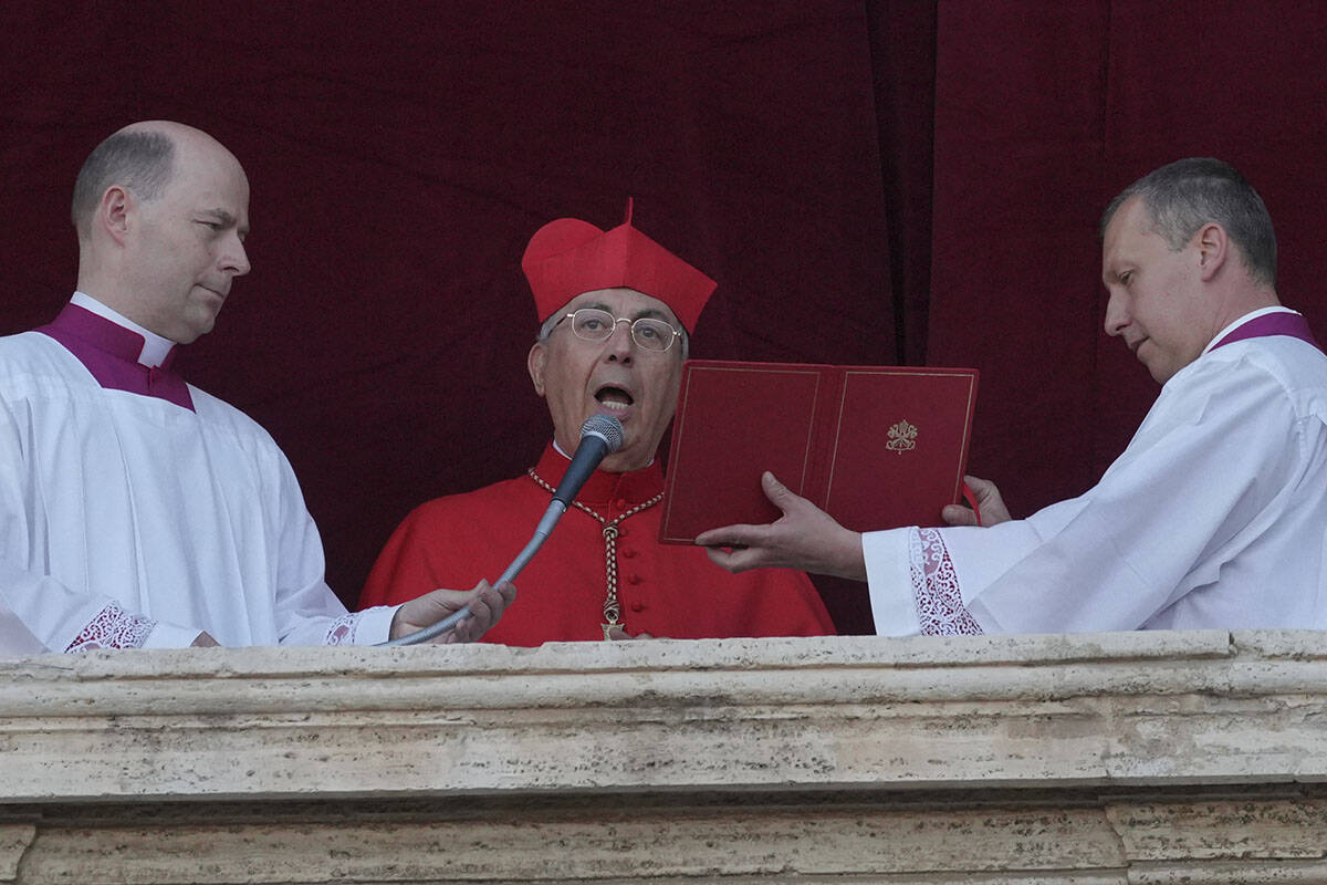 Cardinal Dominique Mamberti announces the election of the new pope, at the Vatican, Thursday, M ...