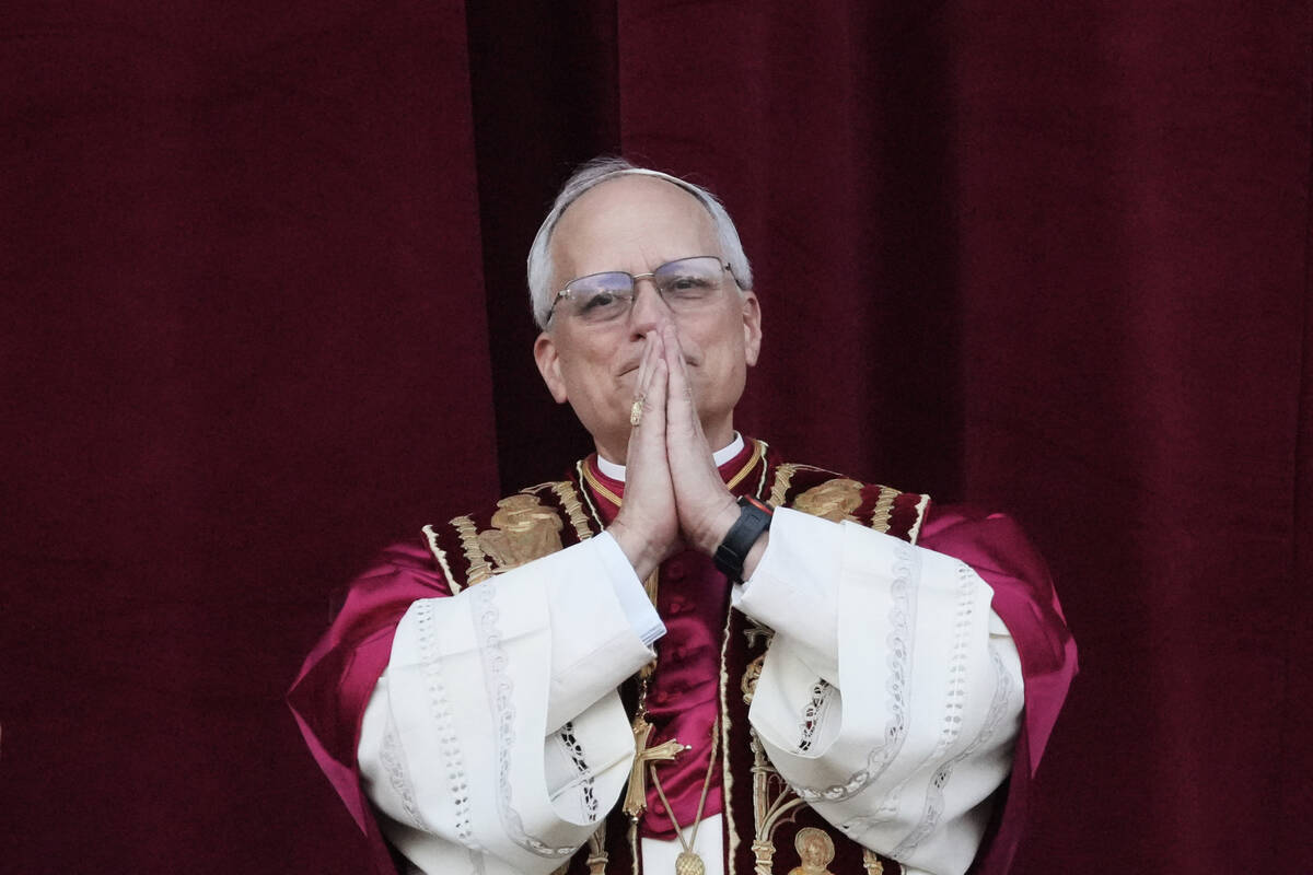 Newly elected Pope Leo XIV appears at the balcony of St. Peter's Basilica at the Vatican, Thurs ...