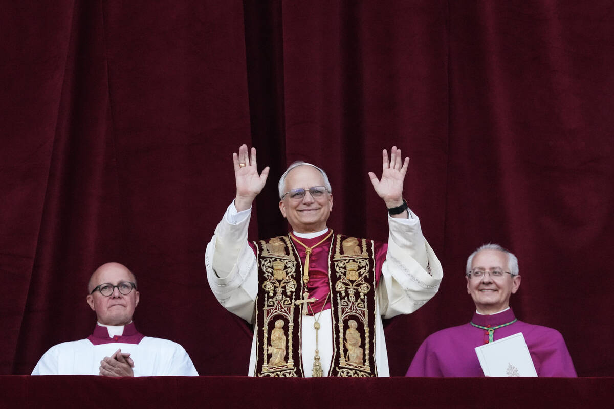Newly elected Pope Leo XIV appears at the balcony of St. Peter's Basilica at the Vatican, Thurs ...