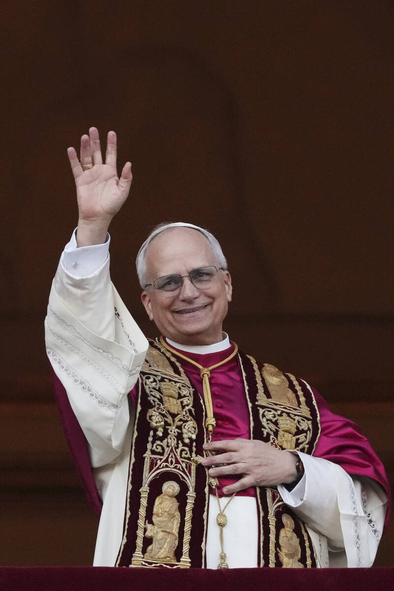 Newly elected Pope Leo XIV appears at the balcony of St. Peter's Basilica at the Vatican, Thurs ...